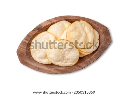 Smoked provolone cheese chips in a bowl isolated over white background. Royalty-Free Stock Photo #2350315359