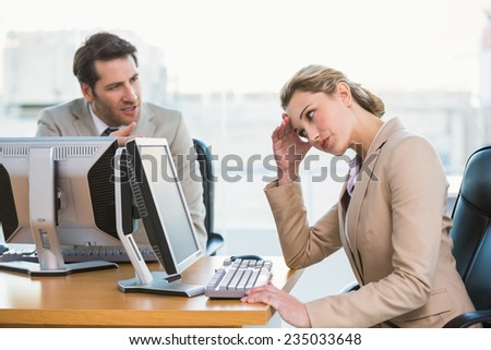 Businessman arguing with a colleague at work Royalty-Free Stock Photo #235033648
