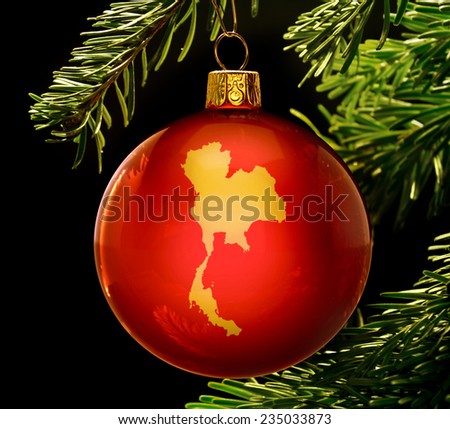 A red bauble with the golden shape of  Thailand hanging on a christmas tree isolated on black.(series)