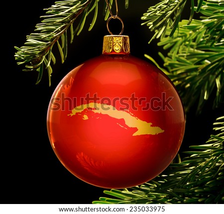 A red bauble with the golden shape of  Cuba hanging on a christmas tree isolated on black.(series)