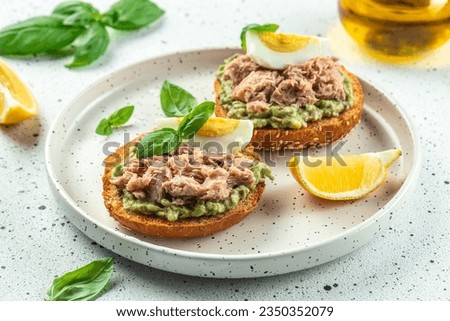 sandwiches with canned tuna, boiled egg and avocado. Food recipe background. Close up. Royalty-Free Stock Photo #2350352079