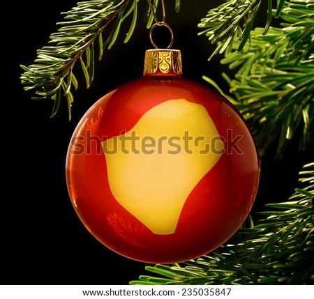 A red bauble with the golden shape of  Burundi hanging on a christmas tree isolated on black.(series)