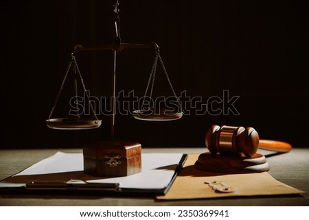 law legal technology concept. judge gavel on computer with scales of justice on desk of lawyer. Royalty-Free Stock Photo #2350369941