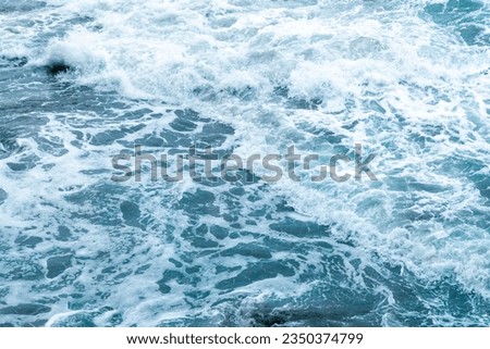 Beautiful blue wave water for abstract background from natural sea ocean in summer, motion texture pattern from outdoor seascape beach travel, aerial view bright splash surface beauty lanscape Royalty-Free Stock Photo #2350374799