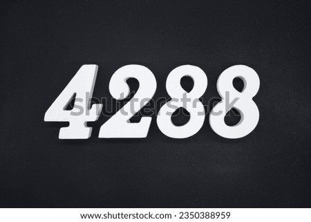 Black for the background. The number 4288 is made of white painted wood.