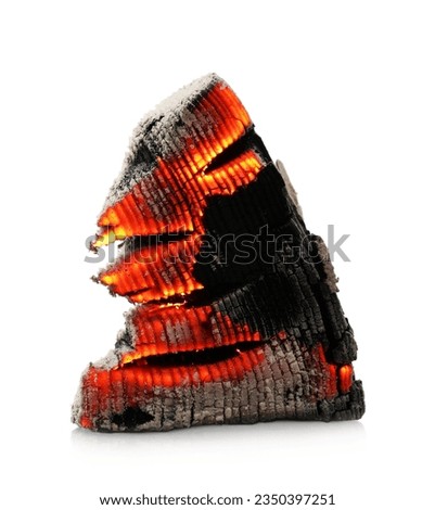 Piece of smoldering coal on white background Royalty-Free Stock Photo #2350397251