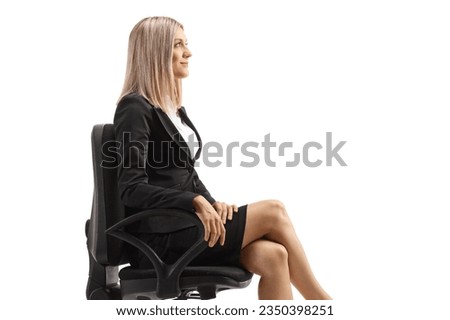 Businesswoman sitting in an office chair isolated on white background