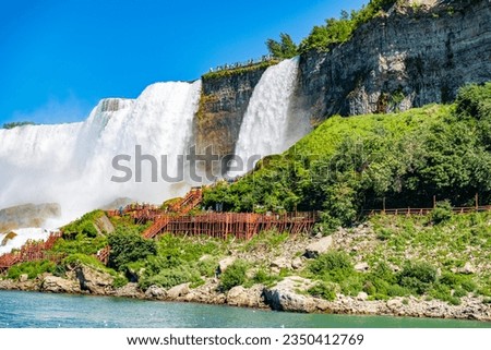 View on the Bridal Veil Falls and American Falls of the Niagara Falls, the part of Goat Island, the Cave of the Winds Lookout, stairs and platforms, wooden walkways, Niagara Falls, New York, USA High