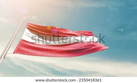 Austria national flag waving in beautiful sky.