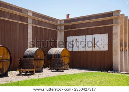 Wine barrels at the entrance of the building