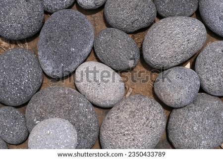 River stone as decoration for the path in the garden. Usually used as a background.