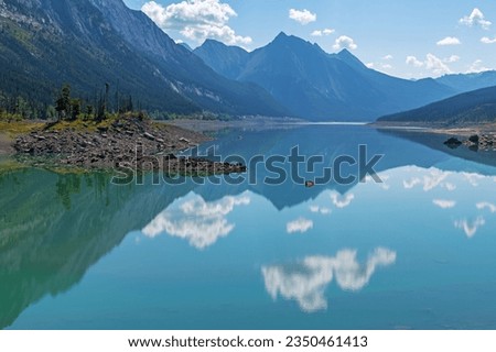 Rocky Mountains reflection in Medicine Lake, Jasper national park, Canada. Royalty-Free Stock Photo #2350461413