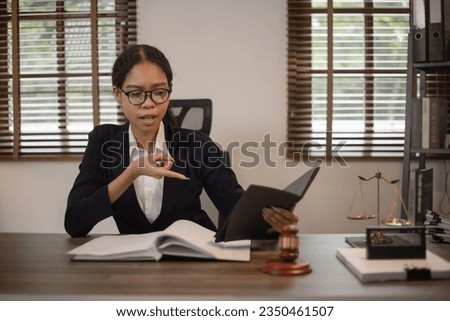 Justice and law concept. Law, legal judgement, courtroom gavel, African American attorney, lawyers discussing contract or business agreement at law firm office.