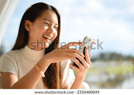 A woman is using a smart phone for various daily activities. The photo is of high quality.