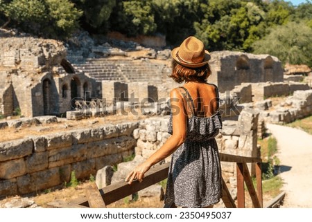 A woman visiting the archaeological ruins of the Butrint or Butrinto National Park in Albania Royalty-Free Stock Photo #2350495037