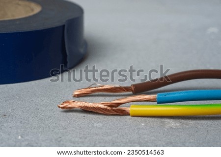 Electrical wires requiring insulation. Insulating tape Royalty-Free Stock Photo #2350514563