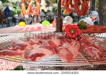 Sausage barbecue located on the street during the Alicante festivities Royalty-Free Stock Photo #2350516201