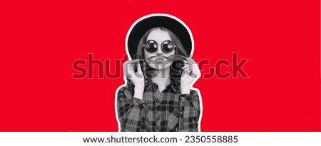 Portrait of funny young woman showing mustache her hair blowing lips sending air kiss on red background, magazine style