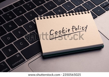 There is wood cube with the word Cookie Policy. It is as an eye-catching image.