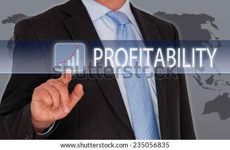 Profitability - Businessman with revenue curve on touchscreen