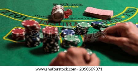 Man playing BlackJack at the casino Royalty-Free Stock Photo #2350569071