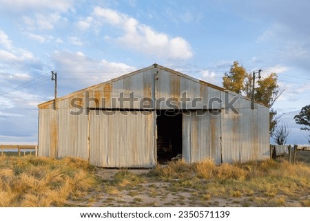 Old country shed in the sunset