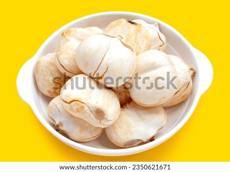 Toddy palm on yellow background. Royalty-Free Stock Photo #2350621671