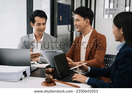 Team lawyer businessmen working with paperwork on his desk in office workplace for consultant lawyer in office.