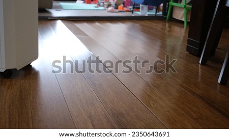 Corrugated wooden floor due to expansion at Living room. Royalty-Free Stock Photo #2350643691