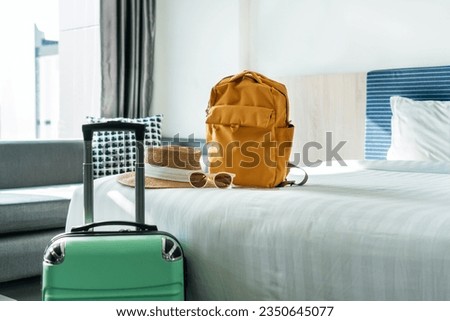 Travel accessories and luggage in hotel room. Summer and holiday concept. Copy space Royalty-Free Stock Photo #2350645077