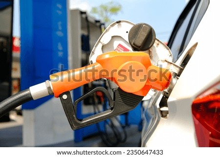 Refuel the car at the refueling point. Energy Concepts Gasoline Gasohol Alternative Energy Royalty-Free Stock Photo #2350647433
