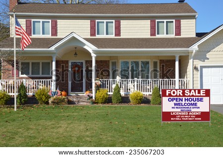 American flag pole Real Estate for sale open house welcome sign Suburban high ranch style home residential neighborhood USA