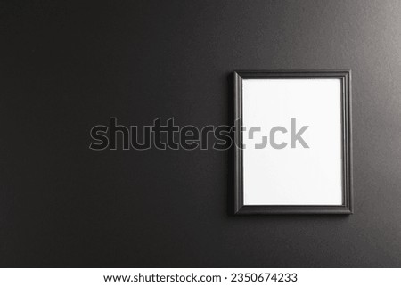 Black frame with copy space on black background. Picture, writing space and home decor concept.