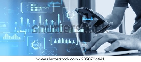 Businessman working with phone and laptop in blurry office, digital business data dashboard and financial analysis. Internet marketing, infographics and KPI. Digital statistics and technology concept