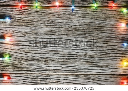 christmas light decorations on wood texture