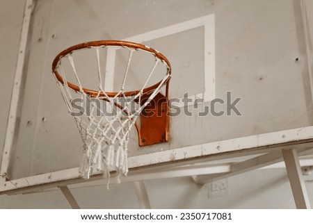 Old antique rusty basketball wooden hoop in school gym


