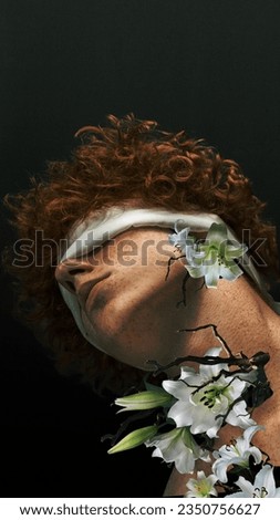 Redhead curly boy with tied eyes and flowers around body. Fantasies. Blooming inside. Contemporary art collage. Concept of surrealism, psychology, inner world, imagination, diversity. Ad