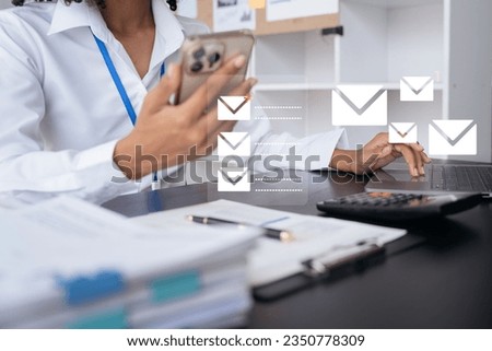 Email notification concept, Female use smartphone and laptop receive message alert in the mailbox.
