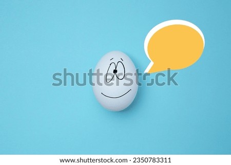 Funny white egg with social chat sign and speech bubbles. Copy space. Like at social network, emoticons concept concept. Art collage