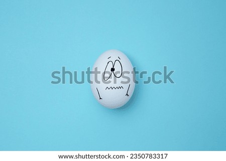 White eggs with a sad face, isolated on the background. Copy space. Emoticons concept. Art collage