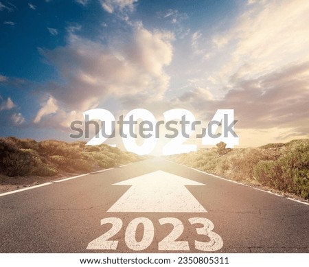 Road and New year 2024 concept. Driving on an empty road to Goals 2024.