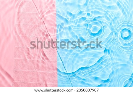 Water pink blue surface abstract background. Waves and ripples texture of cosmetic aqua moisturizer with bubbles
