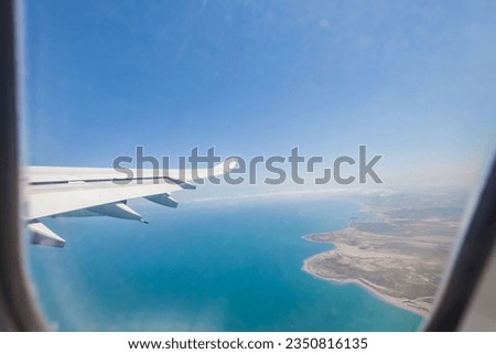 Plane view with wing and cloud