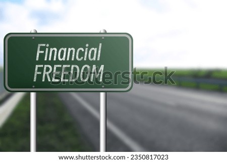 Road sign with words Financial Freedom outdoors