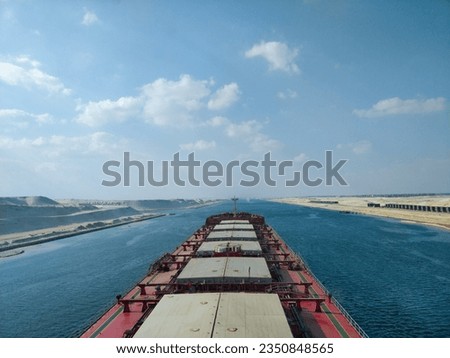 bulk carrier vessel transitting through suez canal, egypt Royalty-Free Stock Photo #2350848565