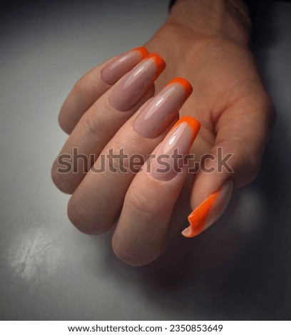 orange colour french manicure long nails Royalty-Free Stock Photo #2350853649