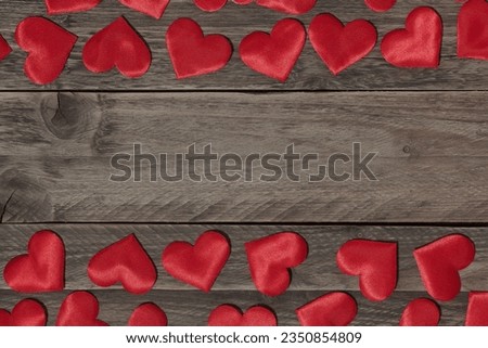 Hearts border over a wood background with space