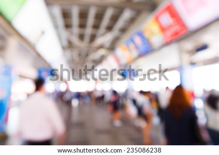 Abstract blurred people walking or standing in train station