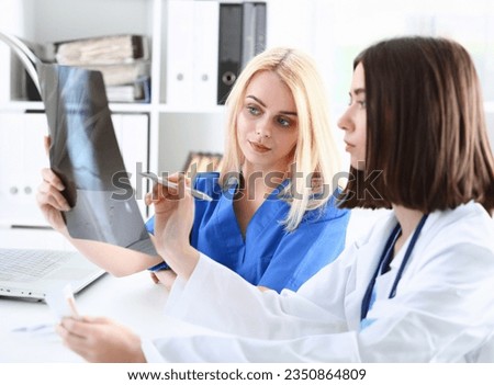 Group of beautiful female doctors hold Royalty-Free Stock Photo #2350864809