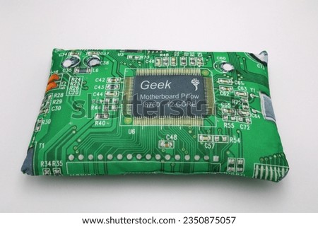 Green geek motherboard pillow for sleeping comfortably for computer nerds on white background